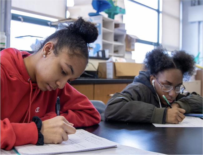 Two students writing